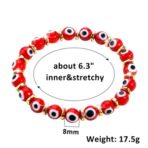 Detail view of 8mm red glass evil eye beads with golden spacers and 16cm elastic band