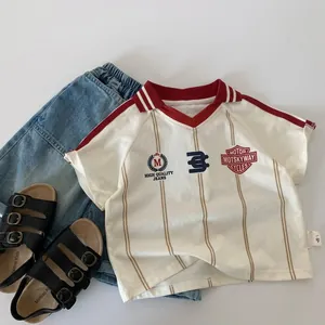 Detail of kids vintage V-neck striped T-shirt with denim shorts and black sandals