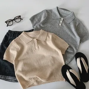 Flat lay of knit cotton polo shirt for kids with vertical stripe texture and denim shorts