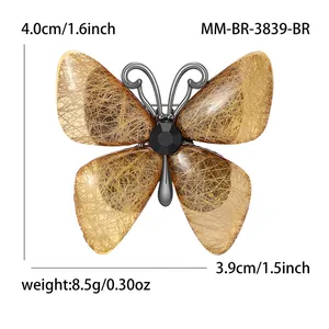 Elegant butterfly brooch with amber texture and black gemstone, size 4.0x3.9cm