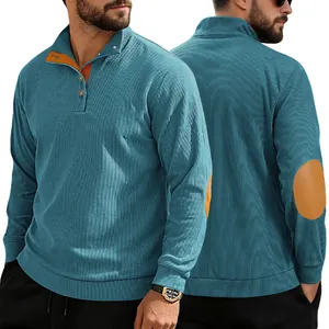 Détail du sweat-shirt en velours côtelé bleu sarcelle pour homme avec col orange et coudières