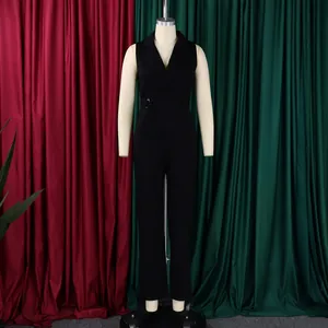 Detail of a black sleeveless jumpsuit with notch lapels and side metal ring buckle