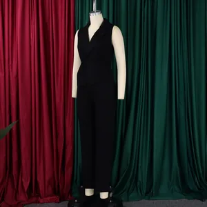 Detail of a chic black sleeveless jumpsuit featuring a notched lapel and waist tie