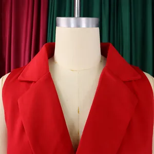 Detail shot of the notched lapel and sleeveless cut on a vibrant red fashion jumpsuit