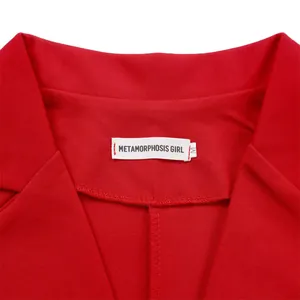 Detailed view of red sleeveless jumpsuit collar with brand label and size tag