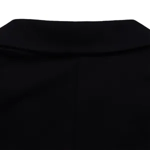 Detail of black notch lapel collar and premium woven fabric texture of the jumpsuit