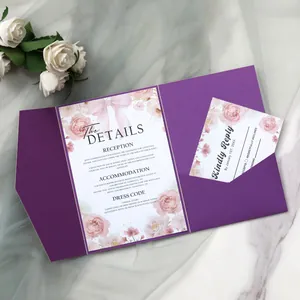 Detailed view of dark purple wedding invitation set with floral card and reply card