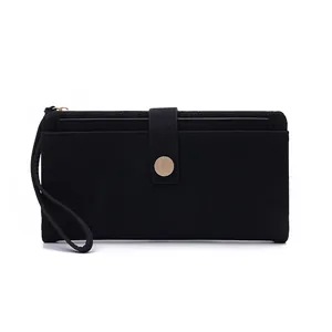 Close-up of black litchi pattern PU leather wallet with golden buckle and wristlet