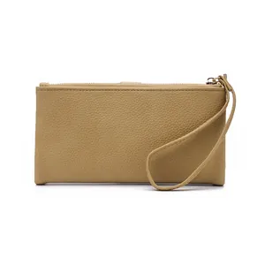 Close-up of khaki litchi grain leather long wallet with wristlet strap and stitching