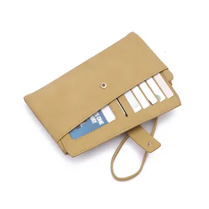 Detailed macro view of khaki long wallet showing card slots and litchi grain leather