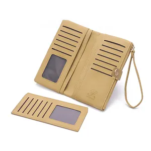 Detail of beige long wallet featuring litchi grain texture and multiple card slots