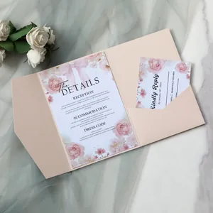 Floral wedding invitation set with laser cut pocket and rose detail on marble