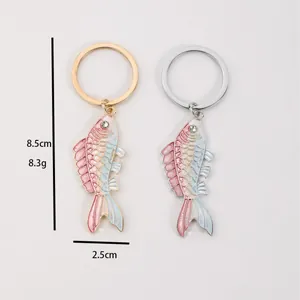 Dual-tone fish keychain with gradient enamel scales and white crystal eye detail
