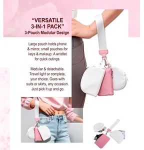 Three-in-one pink and white wristlet pouch showing internal storage for keys and cards