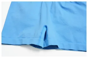 Detailed close-up of seamless knitted blue yoga shorts with reinforced stitching and ribbing