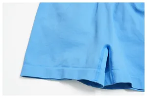 Detailed macro view of light blue seamless yoga shorts with reinforced stitching