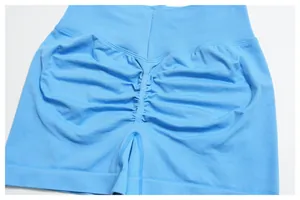 Close-up of sky blue high-waisted seamless scrunch shorts with ribbed waistband