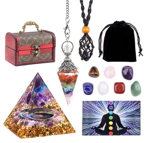 Detailed chakra healing set featuring orgone pyramid, stones, and a wooden storage box