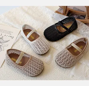 Detailed view of woven Mary Jane shoes for girls in four soft colors on lace background