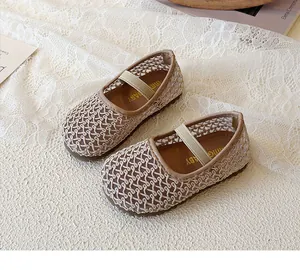 Detailed view of beige woven mesh Mary Jane shoes for girls with elastic strap