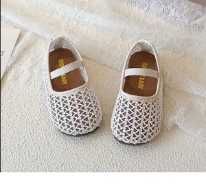 Detail of white hollow woven mesh baby Mary Jane shoes with elastic strap and non-slip sole