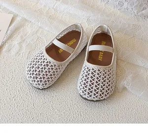 Detail of white mesh woven Mary Jane shoes for children with elastic straps
