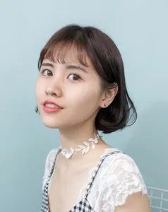 Detailed view of handmade white lace leaf choker with cute red ladybug stud earrings