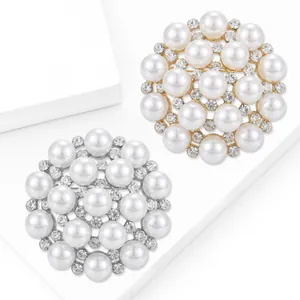 Elegant snowflake pearl brooch with sparkling rhinestones in gold and silver finish