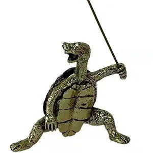 Macro detail of antique brass incense holder in vivid turtle shape with textured shell