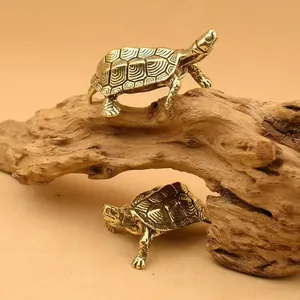 Detail of solid brass tortoise ornaments showing intricate shell textures and antique finish