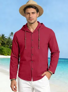 Detail of wine red cotton hooded shirt for men with buttons on a tropical beach background