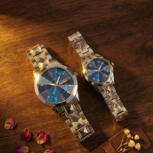 Detail view of OURSTART couple watches with sunray blue dials and two-tone steel bands