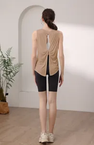 Detail of cross-back yoga top featuring a knot design and breathable open back style