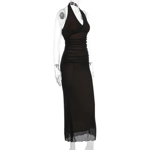 Detail of ruched mesh fabric on a sexy black V-neck maxi dress for summer street style