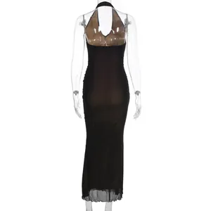 Detail of sheer mesh fabric and halter neck design on a sexy black bodycon dress