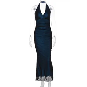 Detail of elegant V-neck halter dress with ruched body and mesh hem in navy blue