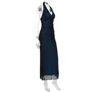 Detail of ruched side seams and deep V-neck on a dark blue gradient bodycon mesh maxi dress