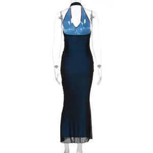 Detail of navy blue halter maxi dress with backless design and sheer mesh hemline