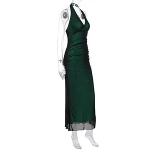 Close-up of ruched dark green bodycon dress with black mesh splicing and V-neckline