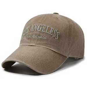 Vintage washed deep khaki baseball cap with white Los Angeles embroidery and rustic texture