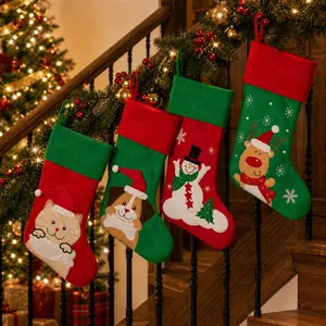 Christmas stockings set with cat dog snowman and reindeer hanging on wooden stairs