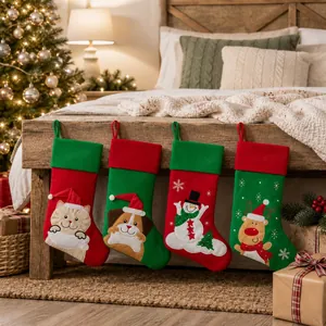 Set of four festive Christmas stockings with cat dog snowman and reindeer patterns