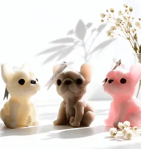 Detailed view of french bulldog candles in white, beige and pink with Thank You tags