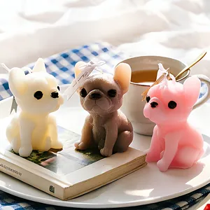 Three colorful French Bulldog aromatherapy candles in ivory, taupe and pale pink colors