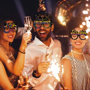 Three assorted 2027 New Year party glasses featuring glittery paper and fun holiday slogans
