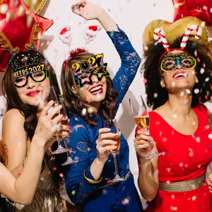 Three women wearing 2027 New Year party glasses and glitter headbands for celebration