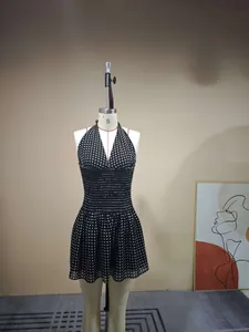 Detail of smocking elastic waist on polka dot halter dress with lightweight chiffon fabric
