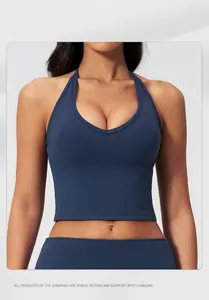 Detail of navy blue halter neck yoga vest showing tight fit and elastic fabric