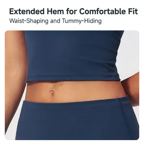 Detail view of the deep blue yoga top featuring an extended hem for a snug and comfortable fit