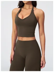Detail of V-neck halter sports bra and high-waist leggings in deep olive green